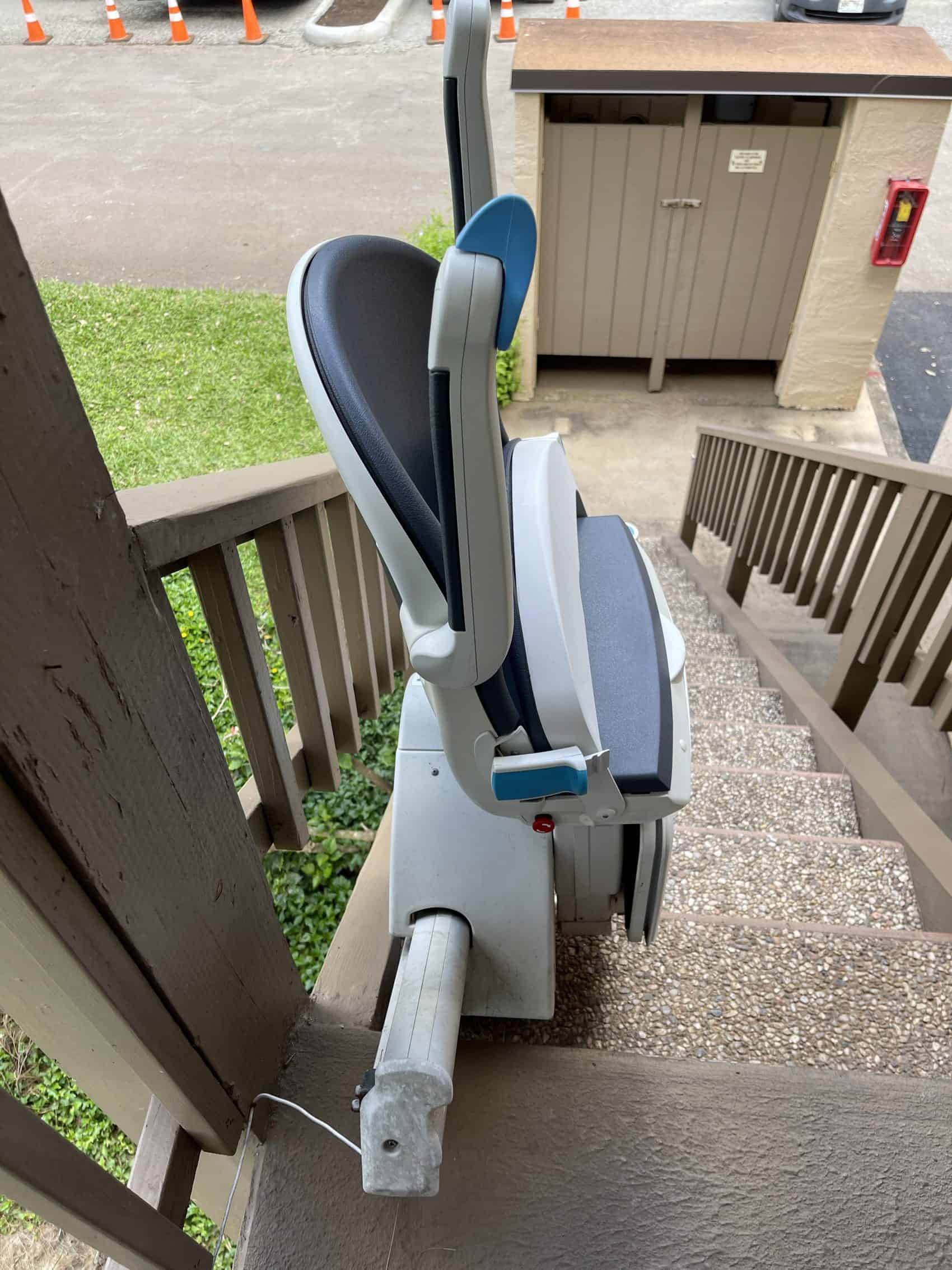 Handicare 1000 outdoor stairlift parked on an exterior stairway
